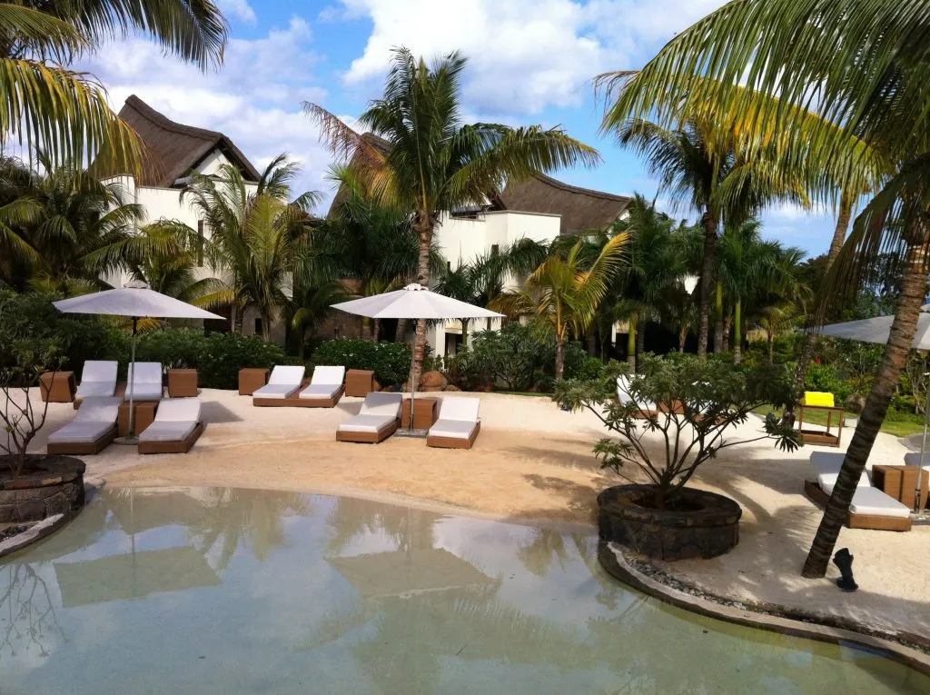 Pool and sun loungers at Le Jadis Beach Resort, Mauritius